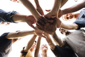 Diverse,Group,Of,People,Hands,Together,Partnership,Teamwork